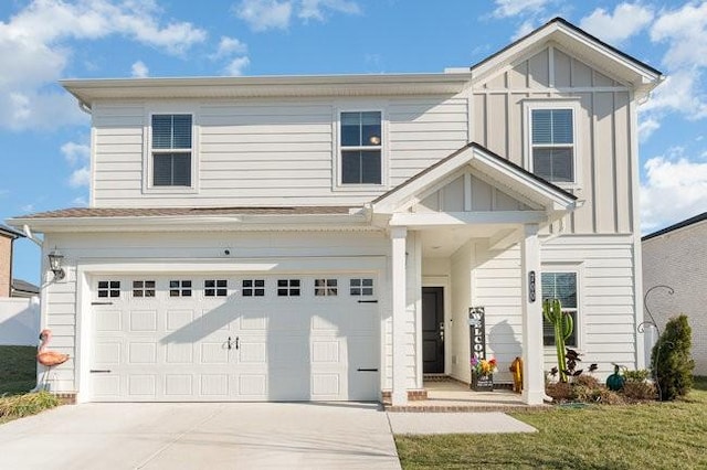 view of front of home featuring a garage, board and batten siding, and driveway