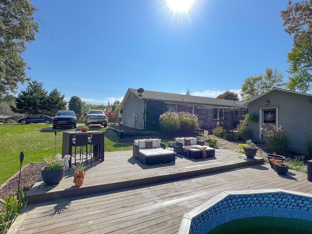 wooden deck with a yard and outdoor lounge area