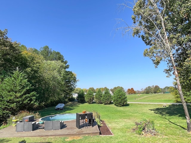 view of pool with a lawn, an outdoor hangout area, and a patio