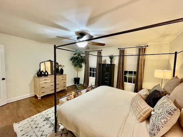 bedroom featuring ceiling fan, baseboards, and dark wood-style flooring