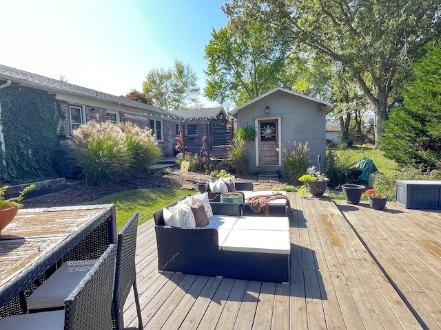 deck with an outbuilding and an outdoor hangout area