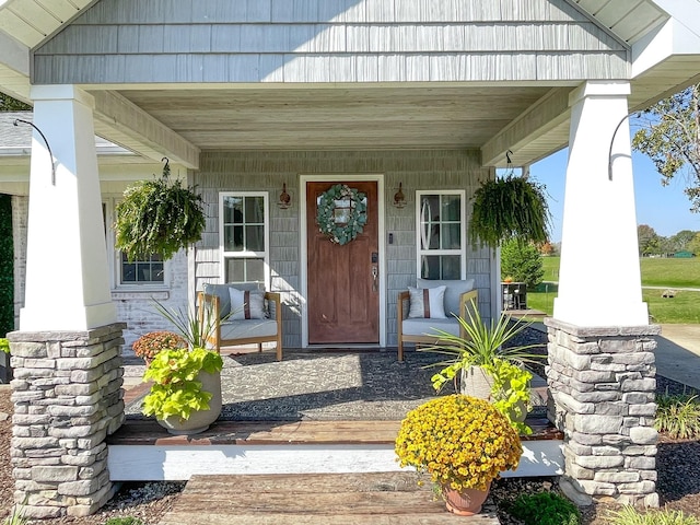 doorway to property with covered porch