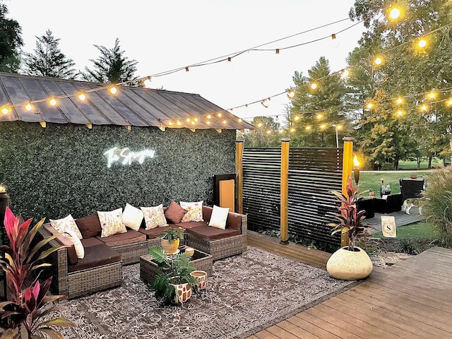 wooden deck featuring an outdoor hangout area