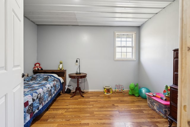 bedroom with wood finished floors