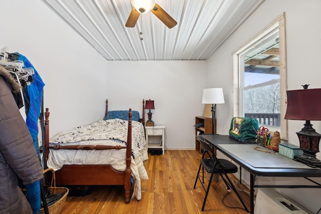 bedroom with a ceiling fan and wood finished floors