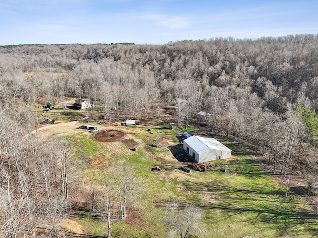 aerial view featuring a wooded view