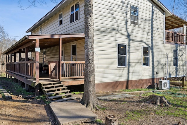 view of home's exterior with ac unit and covered porch