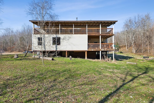 back of house with a lawn