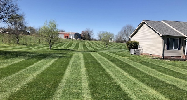 view of yard with central AC