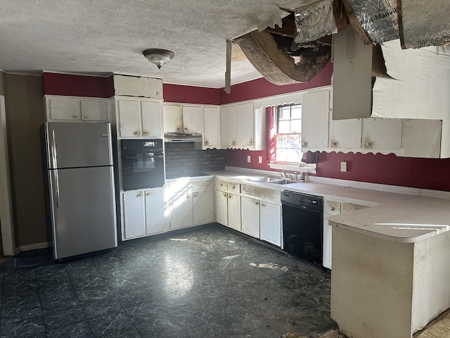 kitchen featuring white cabinetry, black appliances, ventilation hood, and light countertops