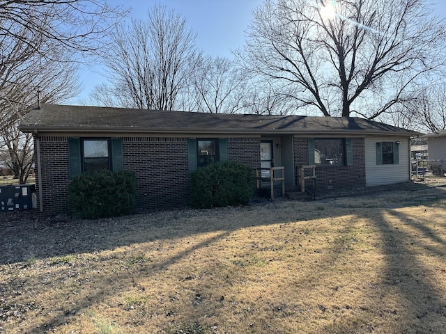 view of front of house featuring brick siding