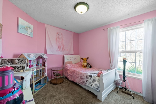 bedroom featuring a textured ceiling, baseboards, and carpet floors