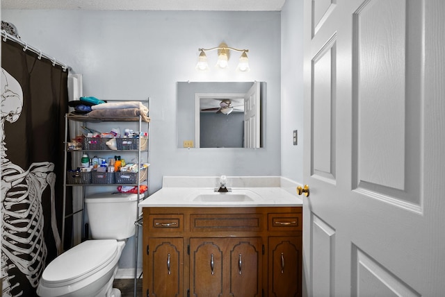 bathroom with toilet and vanity