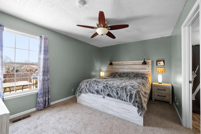 bedroom with multiple windows, carpet, visible vents, and baseboards