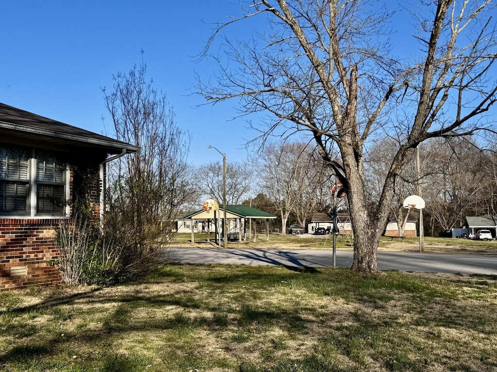 view of yard featuring community basketball court