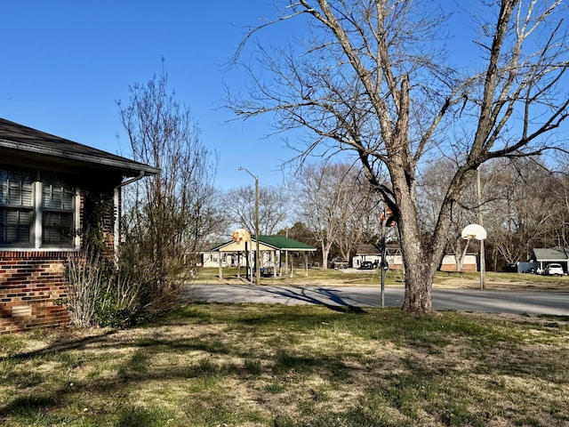 view of yard featuring community basketball court