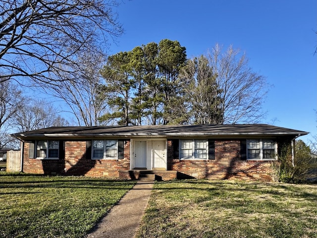 ranch-style house with crawl space, brick siding, and a front lawn