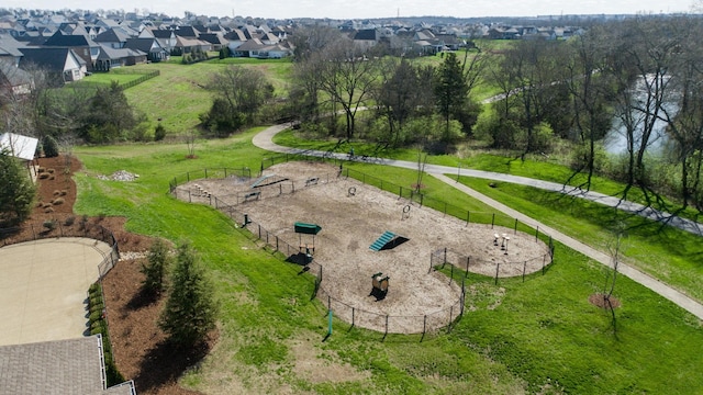 view of community featuring fence and a residential view