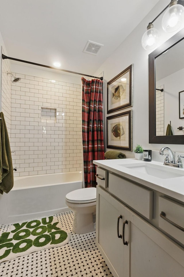 full bath featuring shower / bath combo with shower curtain, toilet, and vanity