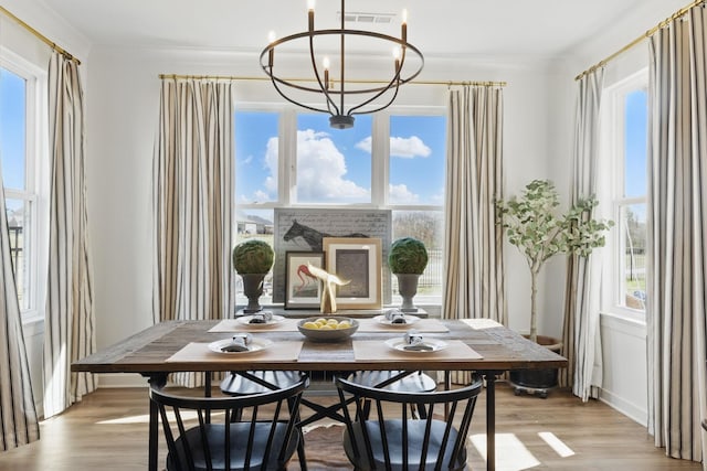 dining room with light wood finished floors and plenty of natural light