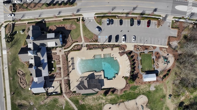 aerial view of property's location featuring a pool