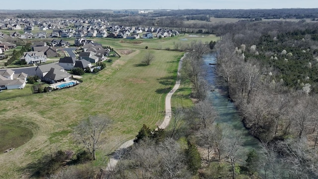 aerial view of property and surrounding area with nearby suburban area
