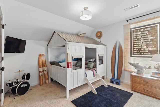 bedroom featuring carpet floors and lofted ceiling