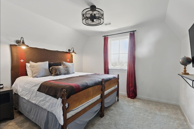 carpeted bedroom featuring lofted ceiling, a chandelier, and baseboards