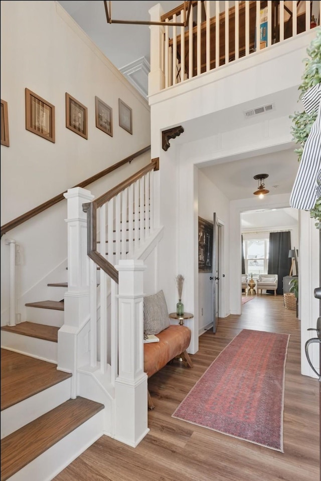 stairway with wood finished floors