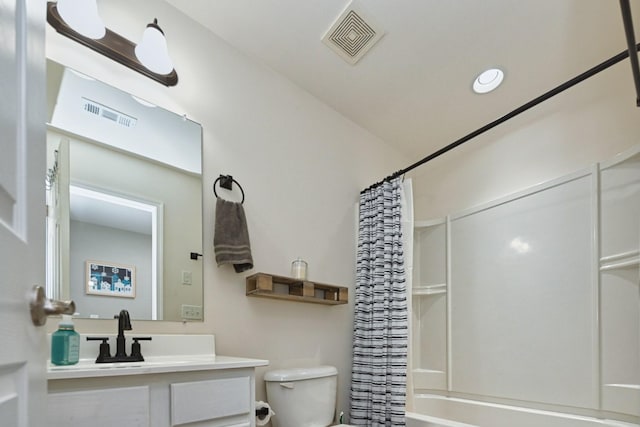 bathroom featuring visible vents, toilet, vanity, and shower / bath combo