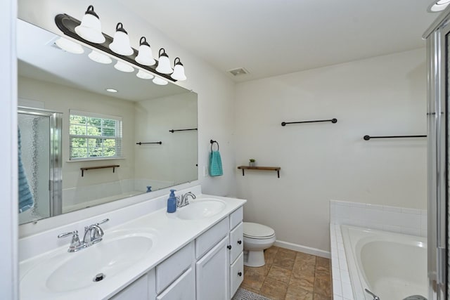 bathroom featuring a bath, double vanity, baseboards, and a sink