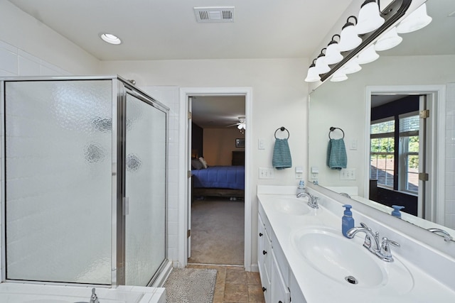 ensuite bathroom featuring a shower stall, visible vents, ensuite bathroom, and a sink