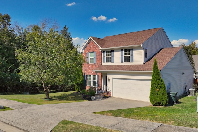 colonial home featuring a front yard, driveway, roof with shingles, central AC, and brick siding