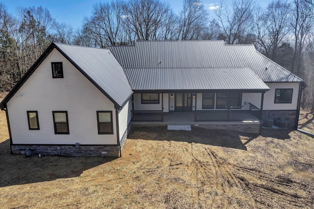 view of front of home with a porch and metal roof