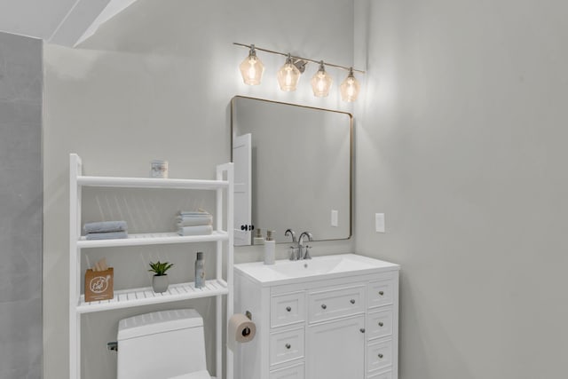 bathroom with vanity and toilet