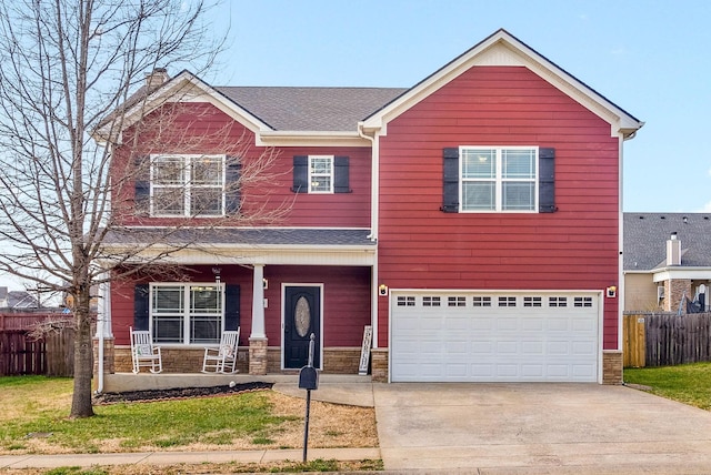 view of front of property featuring fence, covered porch, a garage, stone siding, and driveway