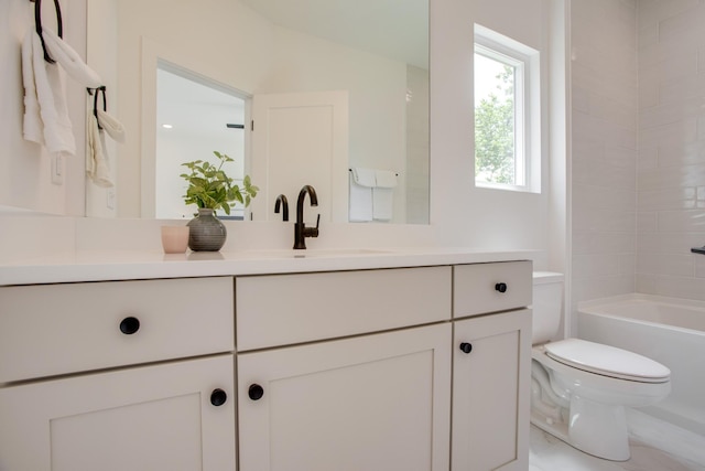 full bath featuring vanity, toilet, and shower / washtub combination