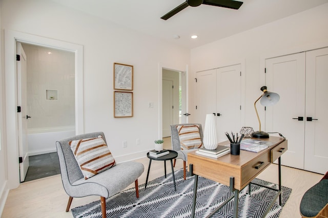 office space featuring recessed lighting, baseboards, light wood-style flooring, and ceiling fan