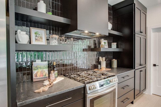 kitchen featuring light wood-style flooring, open shelves, island exhaust hood, tasteful backsplash, and stainless steel range with gas cooktop