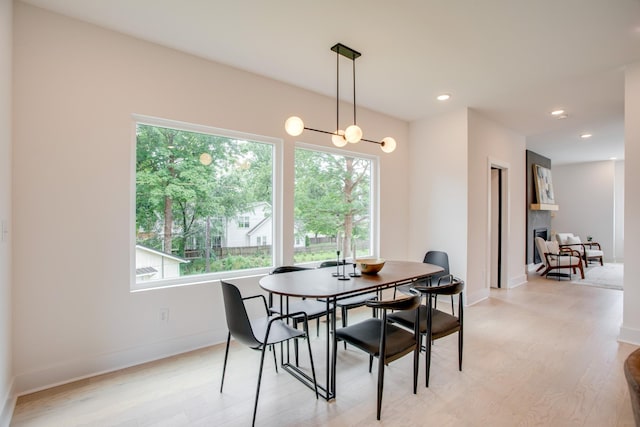 dining space with recessed lighting, baseboards, and light wood-style floors