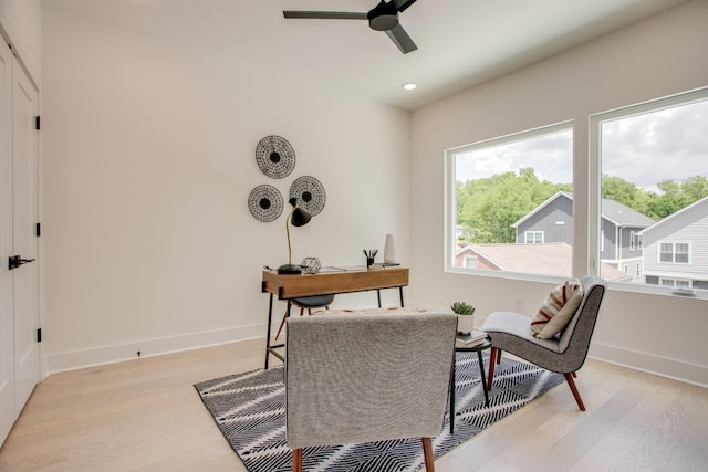 office space with a ceiling fan, recessed lighting, baseboards, and light wood-type flooring