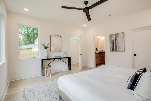 bedroom featuring visible vents, ensuite bath, recessed lighting, light wood finished floors, and baseboards