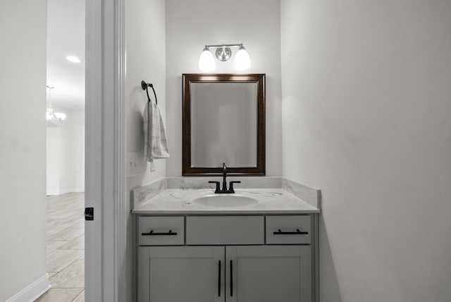 bathroom with vanity and baseboards