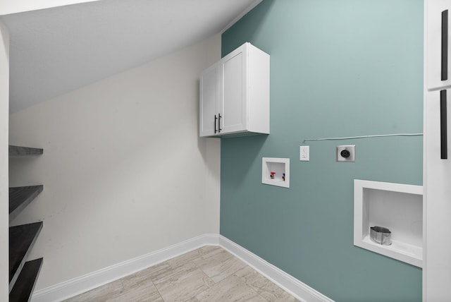 laundry room featuring electric dryer hookup, baseboards, cabinet space, and washer hookup