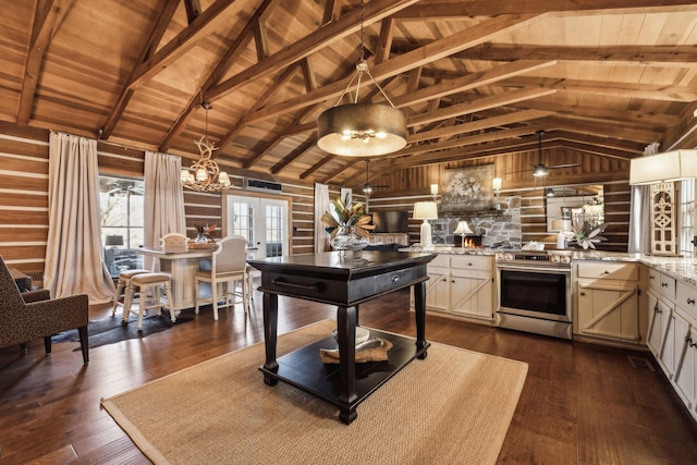 kitchen featuring dark wood finished floors, vaulted ceiling with beams, stainless steel range with electric stovetop, and wood ceiling