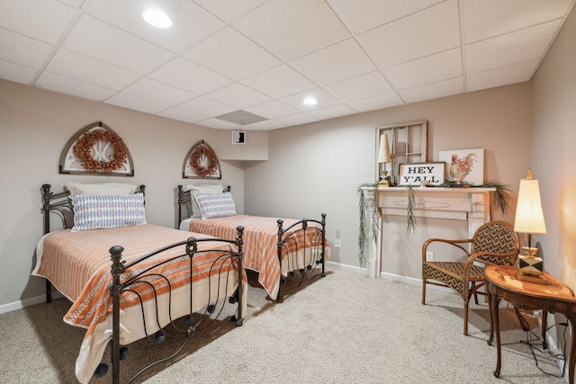 bedroom featuring recessed lighting, carpet, baseboards, and a drop ceiling
