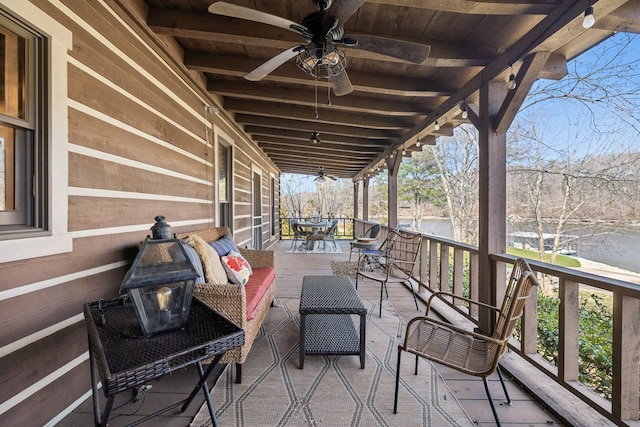 view of patio / terrace featuring outdoor dining area and a ceiling fan