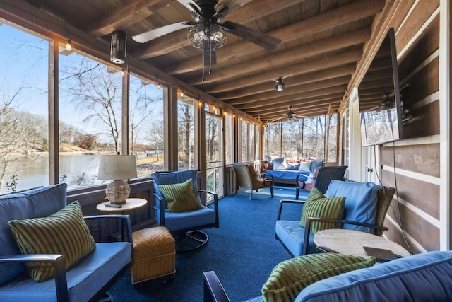 sunroom with an outdoor living space, beam ceiling, and a ceiling fan