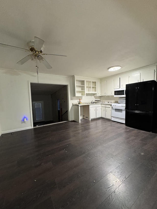 kitchen featuring white appliances, light countertops, dark wood-type flooring, and open shelves