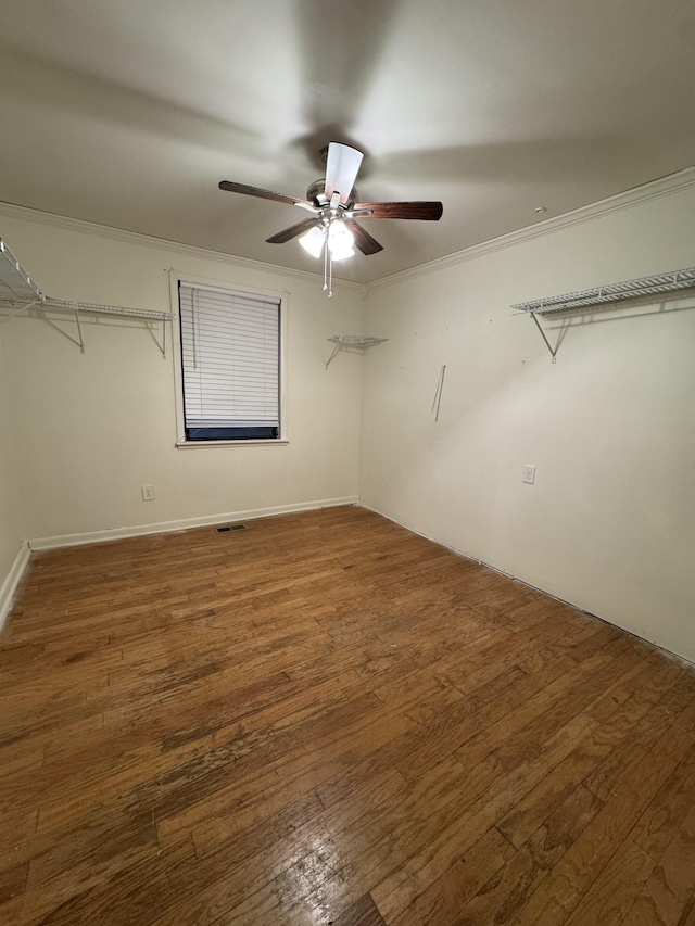 walk in closet featuring visible vents, ceiling fan, and hardwood / wood-style floors